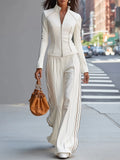 Ensemble blanc avec col mao, fermeture éclair et pantalon large