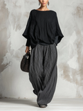 Ensemble noir composé d'un haut plissé chauve-souris et d'un pantalon large
