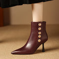 Bottines en cuir avec boutons décoratifs