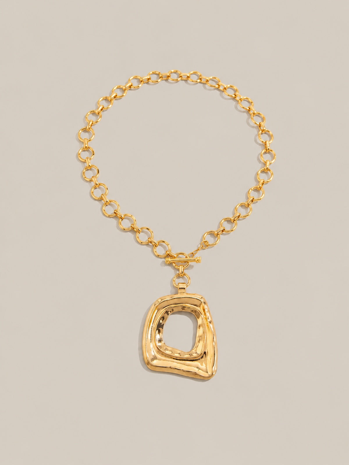 Collier avec pendentif abstrait et fermoir mousqueton